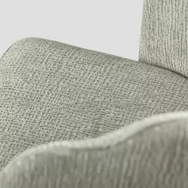 détail de l'assise de la chaise qui met en évidence le tissu légèrement gaufré, couleur vert pastel