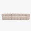 Canapé de salon en tissu beige avec formes douces et arrondies offrant de belles dimensions : largeur 304 cm, profondeur 100 cm pour un confort optimal. Vue de face.