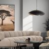 Salon séjour moderne avec le canapé 4 places en tissu bouclé couleur sable NEW YORK SAND, la table basse ronde ELYNE avec son plateau en granit noir et piètement fin au design élégant, la chaise ROCK BROWN en tissu brun avec sa forme tressée originale.